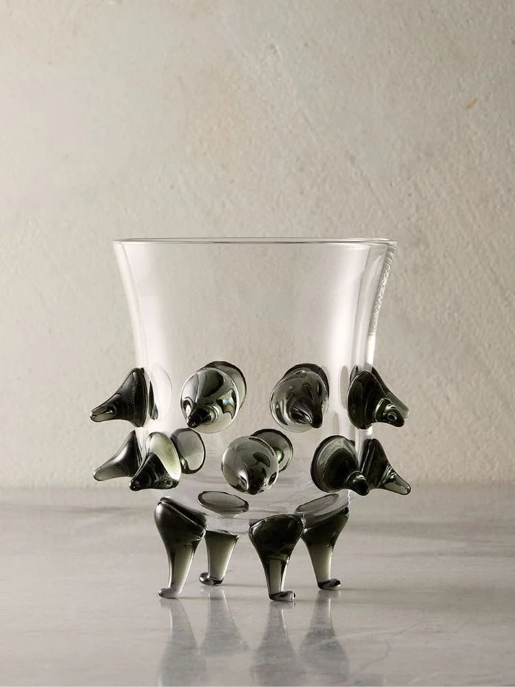 Image may contain: Glass, Goblet, Clothing, Footwear, High Heel, Shoe, Jar, Pottery, and Vase