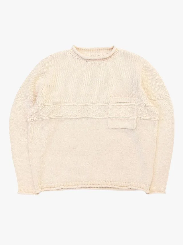 Image may contain: Cap, Clothing, Hat, Knitwear, Sweater, and Sweatshirt