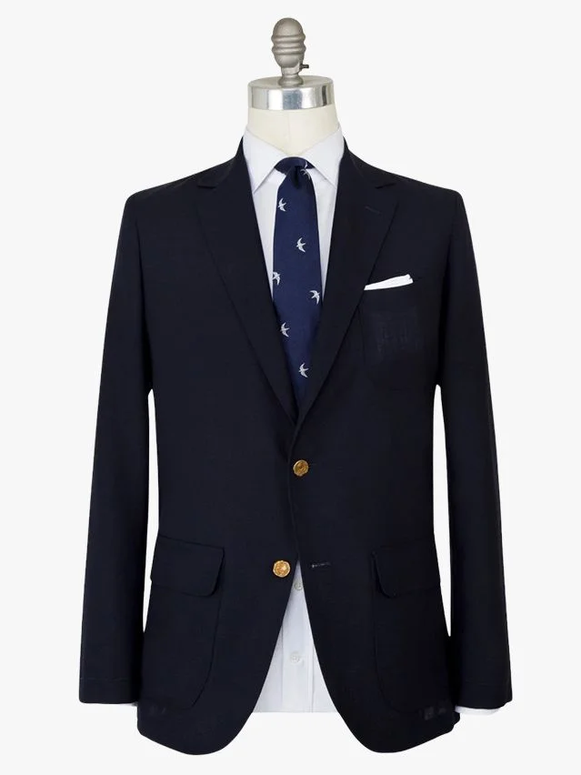 Image may contain: Blazer, Clothing, Coat, Jacket, Formal Wear, Suit, Accessories, and Tie