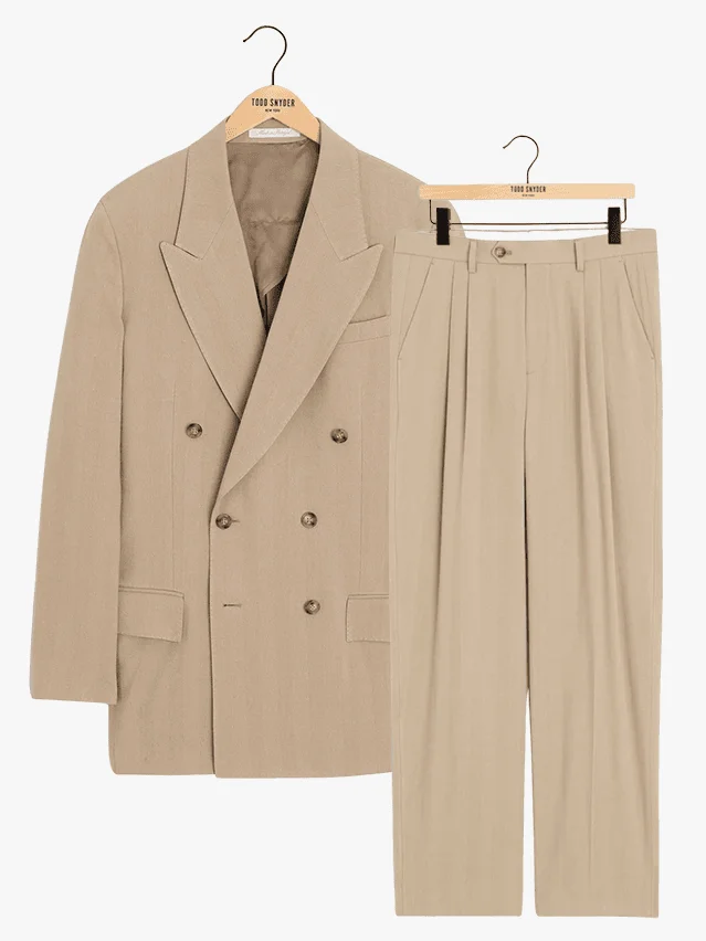Image may contain: Clothing, Coat, Home Decor, Linen, Jacket, Khaki, Overcoat, Blazer, Formal Wear, and Suit