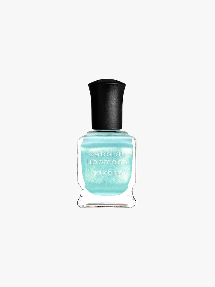 Image may contain: Bottle, Cosmetics, Perfume, and Nail Polish