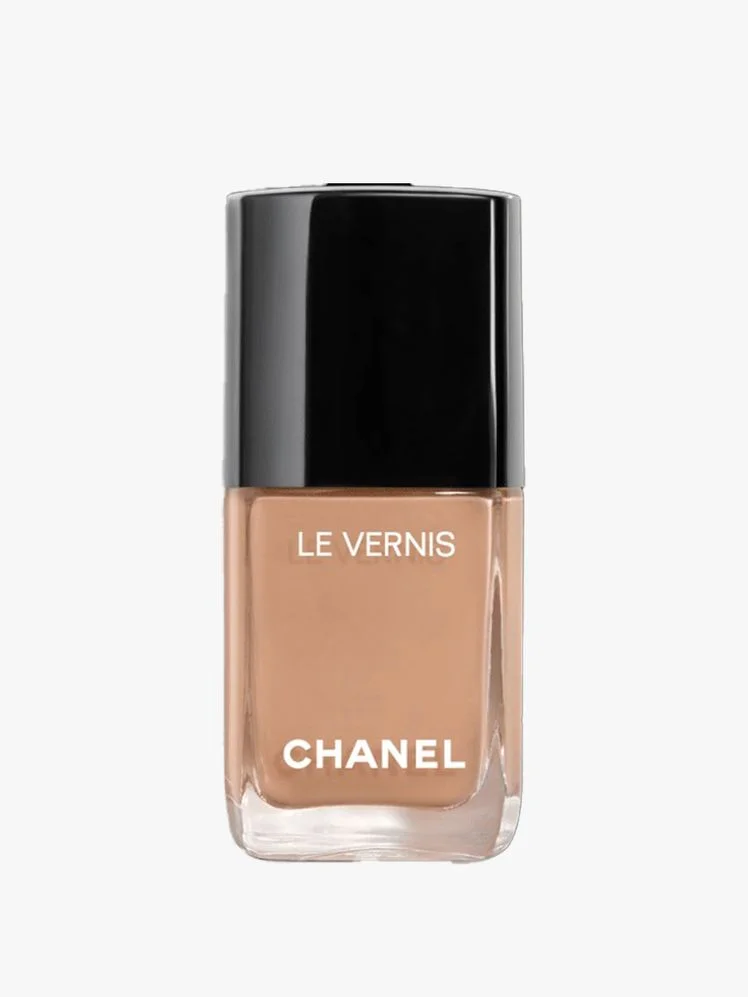 Image may contain: Cosmetics, Bottle, Perfume, Face, Head, Person, and Nail Polish