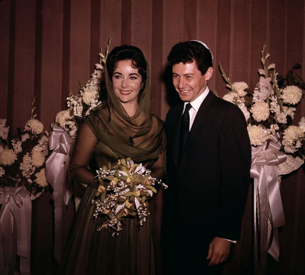 Elizabeth Taylor marries Eddie Fisher.