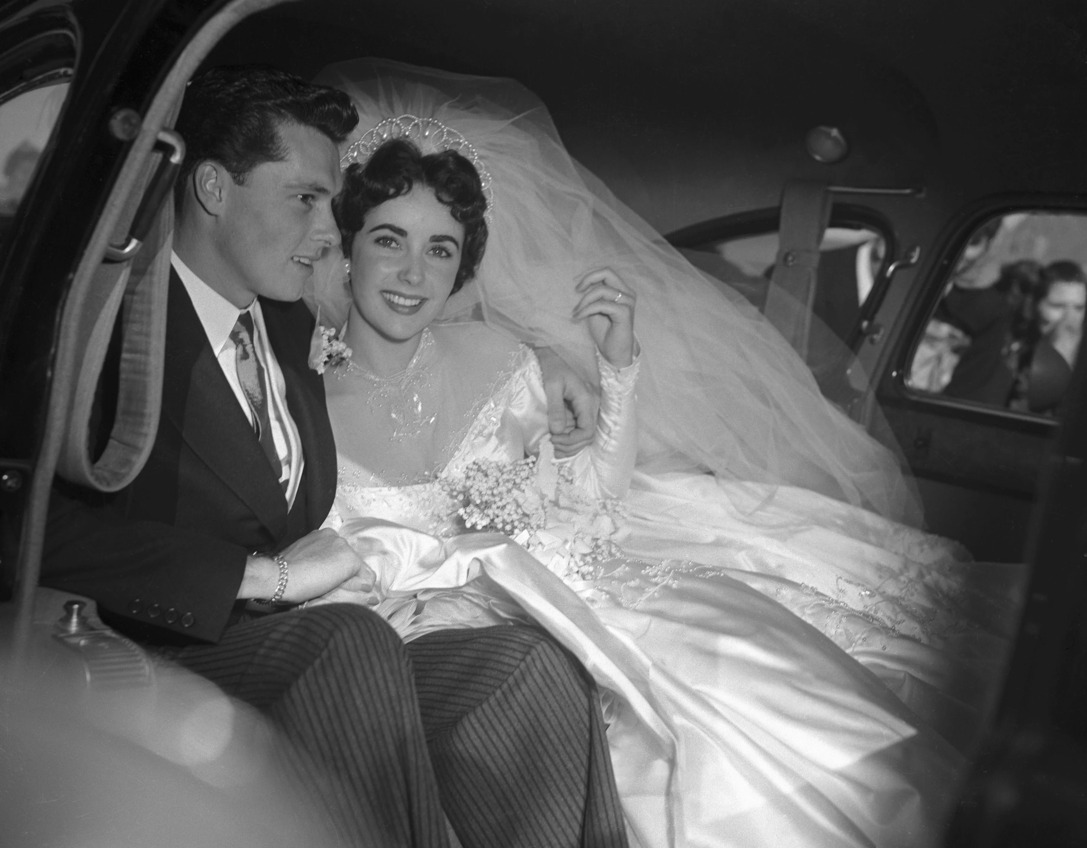 A Detailed Look at Elizabeth Taylor’s 8 Wedding Dresses