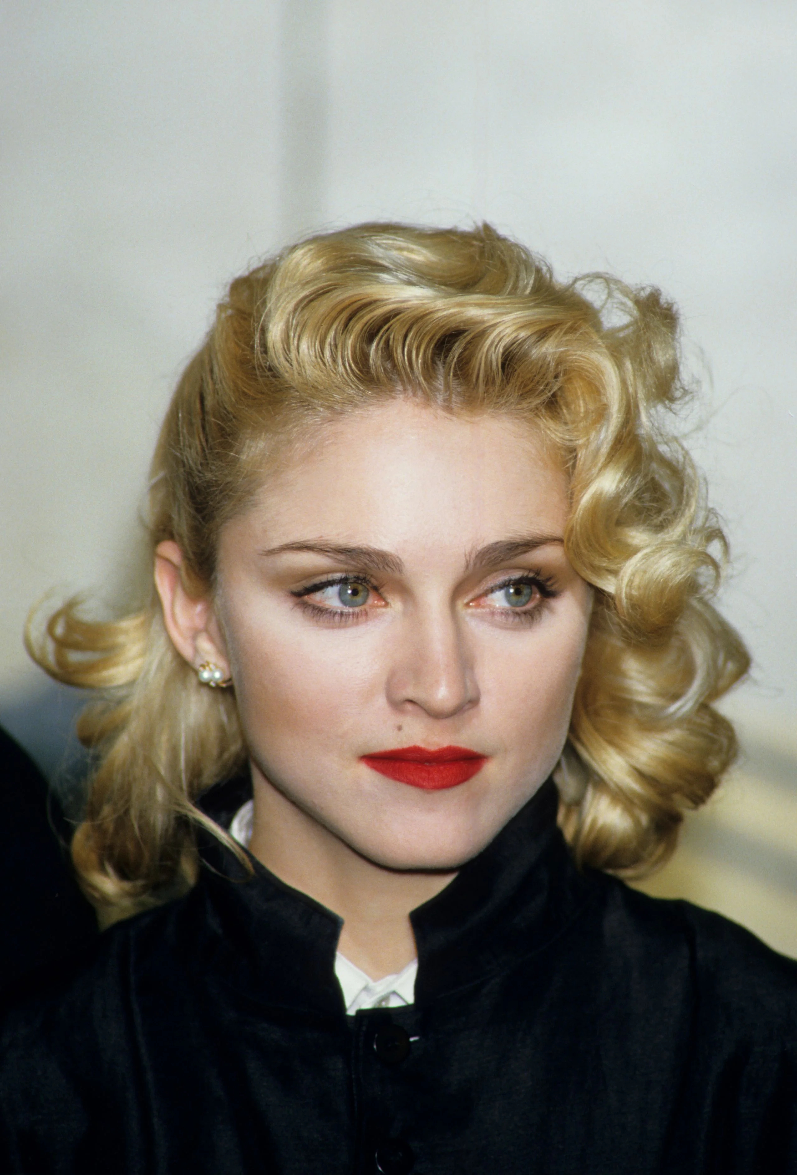Image may contain Madonna Blonde Hair Person Adult Face Head Photography and Portrait