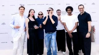 Image may contain Yarmak Clothing Pants Adult Person Accessories Sunglasses Groupshot People Jeans Coat and Face