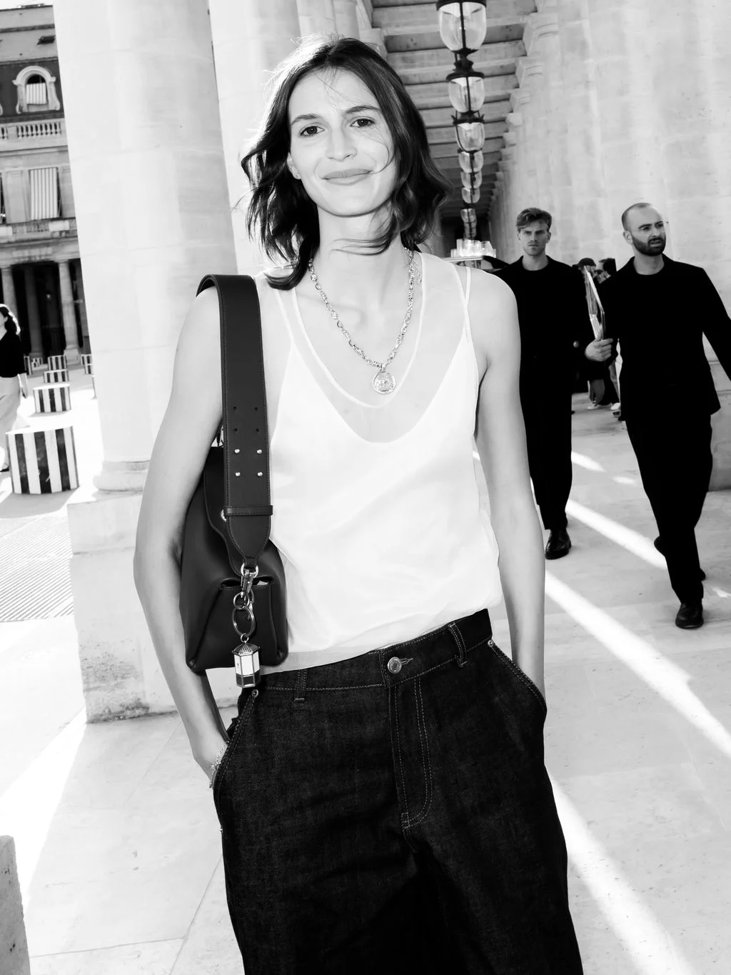 Image may contain Kenza Fourati Accessories Bag Handbag Face Head Person Photography Portrait Clothing and Pants