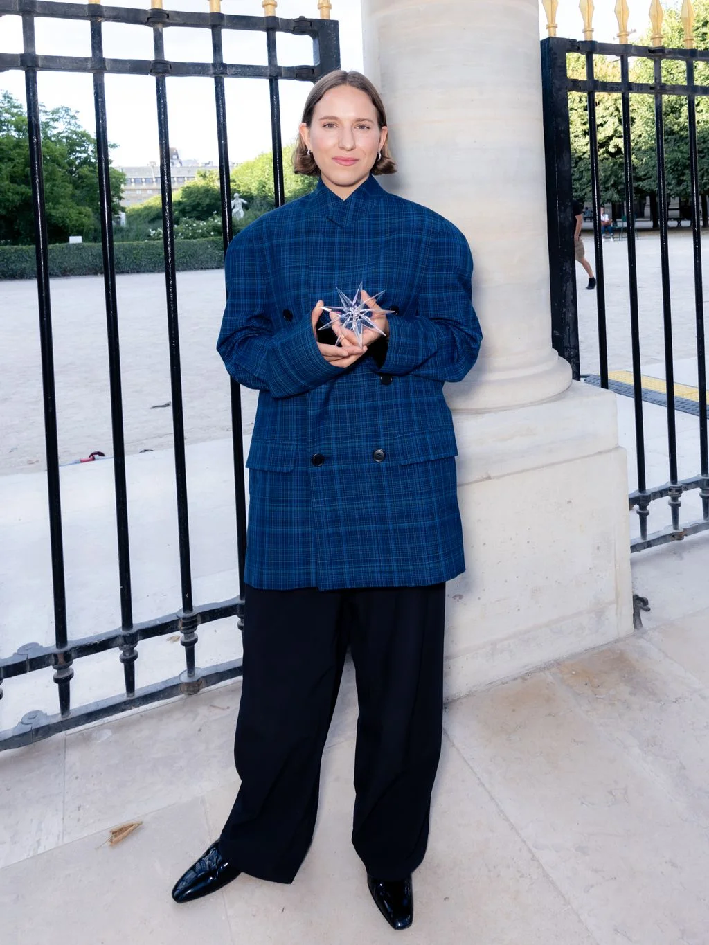 Image may contain Person Standing Clothing Coat Adult and Pants