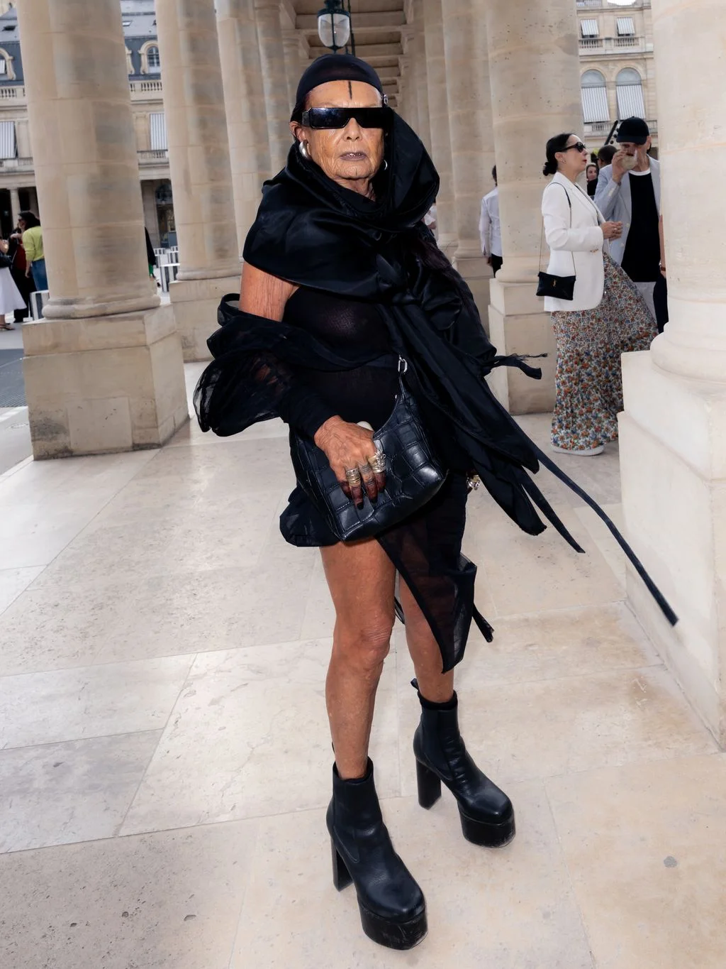 Image may contain Peggy Moffitt Justin Simmons Eugene Sims Clothing Footwear Shoe Accessories Bag Handbag and Adult