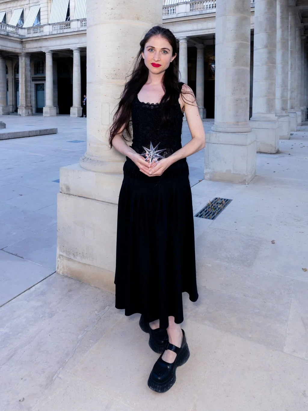 Image may contain Raffey Cassidy Clothing Dress Formal Wear Evening Dress Person Teen Standing Footwear and Shoe