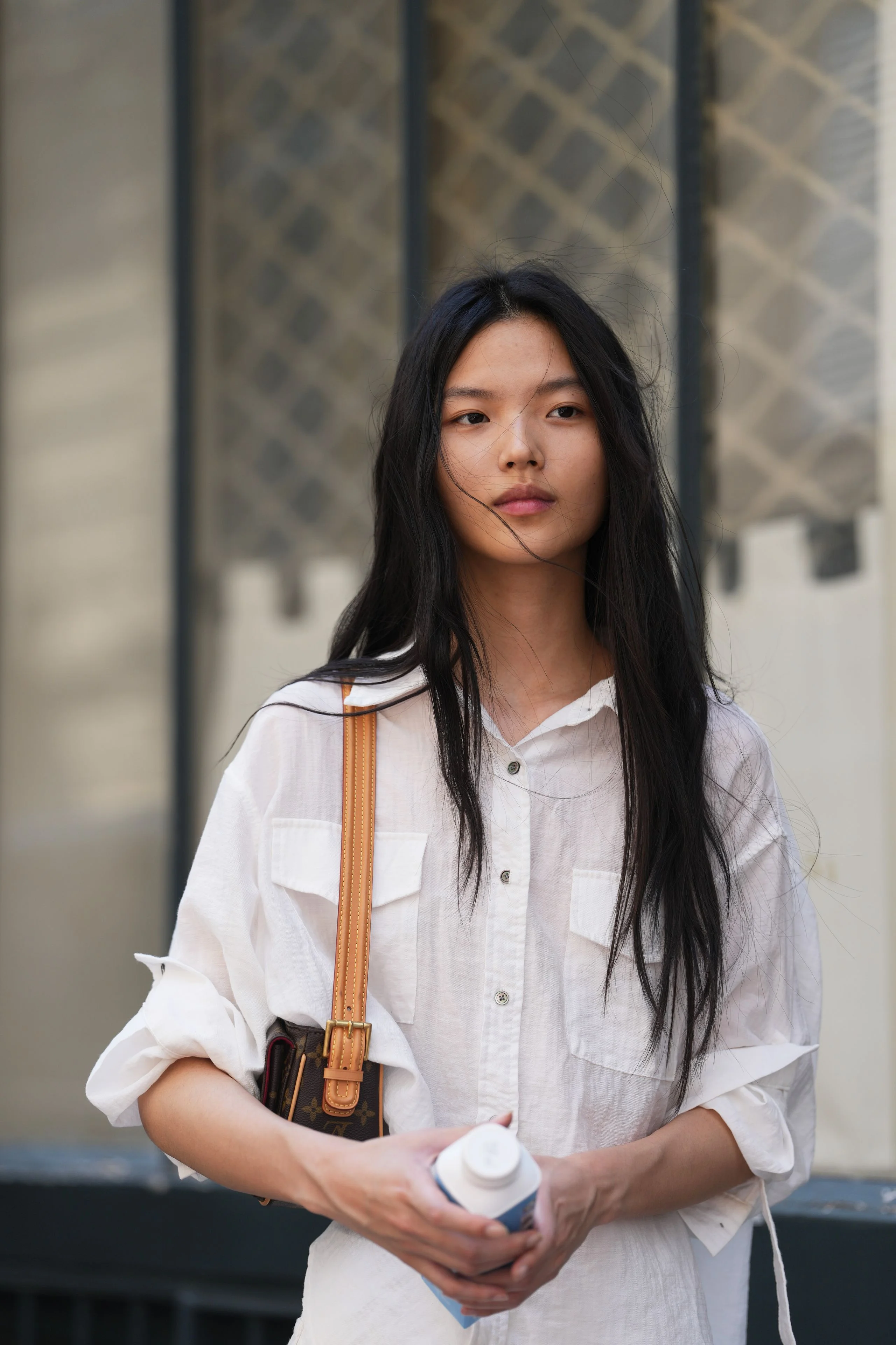 Image may contain Black Hair Hair Person Teen Face Head Blouse and Clothing