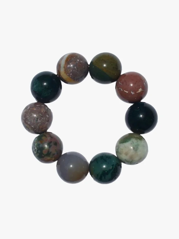 Image may contain: Accessories, Jewelry, Gemstone, Bracelet, Bead, and Smoke Pipe