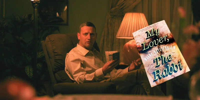 Tim Robinson in chair in Friendship, My Lover the Rabbi