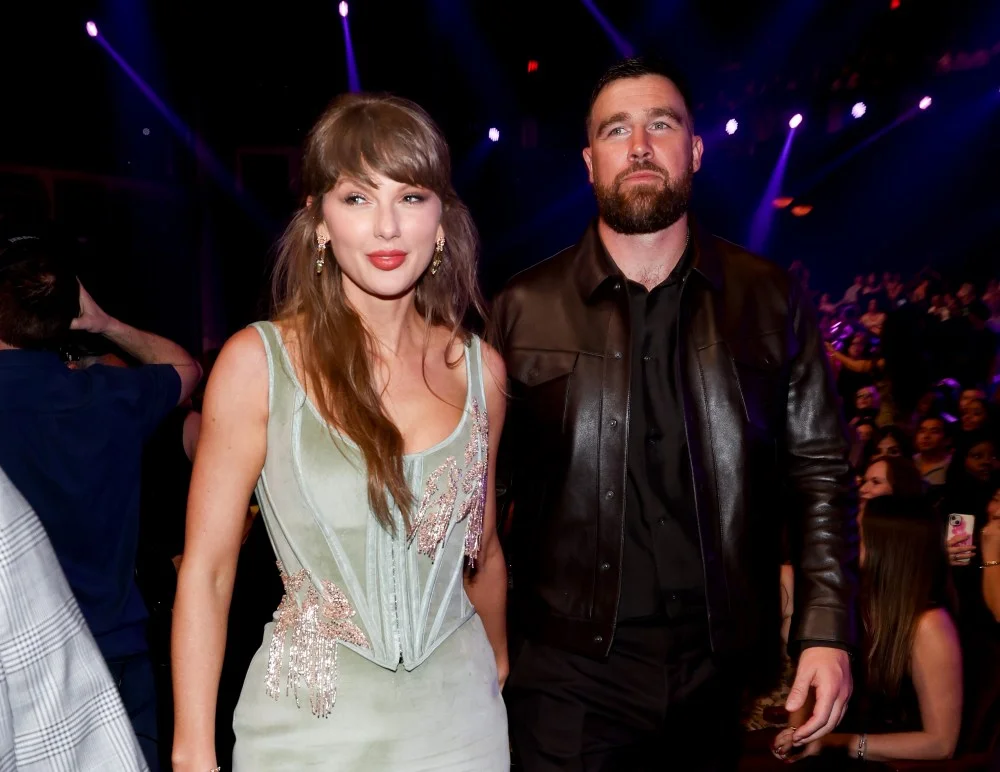Taylor Swift and Travis Kelce at the 2026 iHeartRadio Music Awards; the two said "I do" on July 3, and Swift walked down the aisle in custom Louboutins.