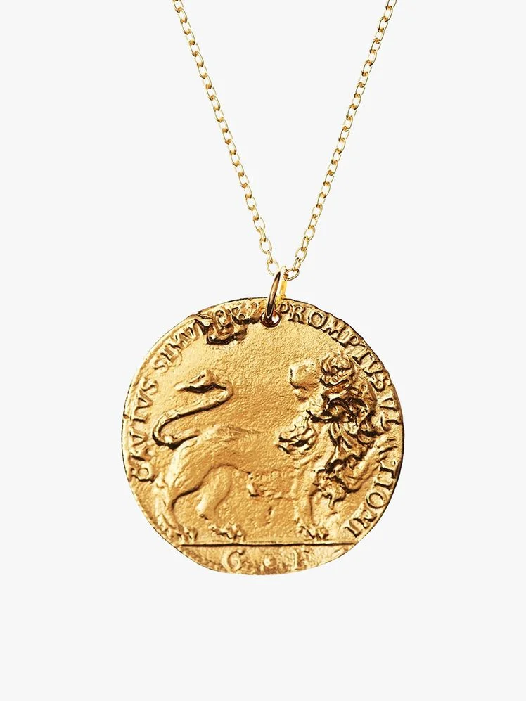 Image may contain: Accessories, Gold, Pendant, Jewelry, and Necklace