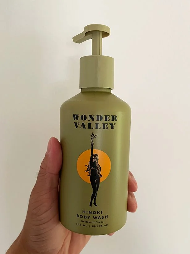 Image may contain: Bottle, Lotion, Cosmetics, Perfume, and Person