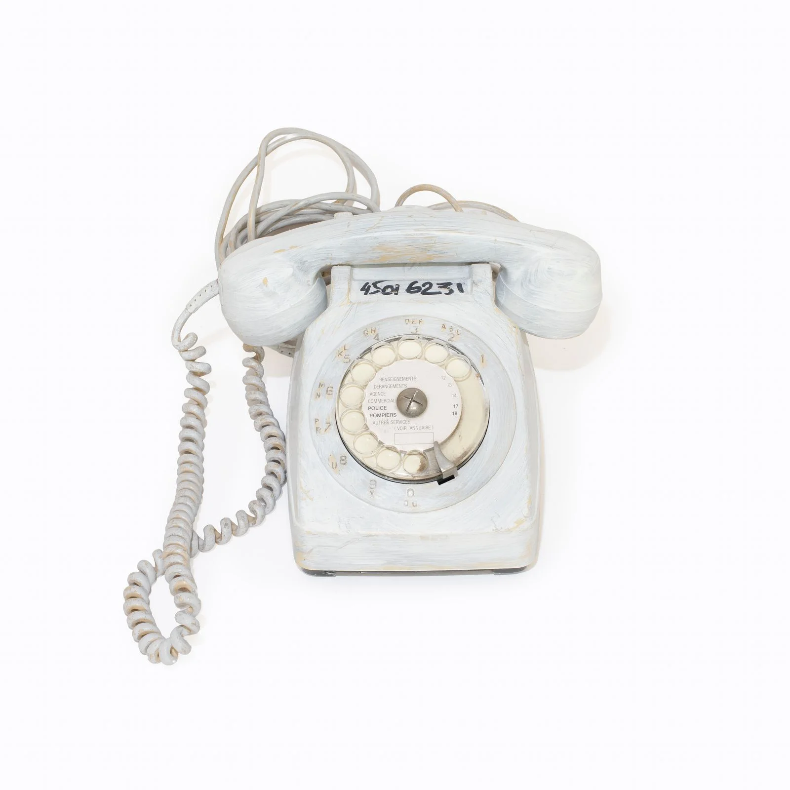 Image may contain Electronics Phone and Dial Telephone