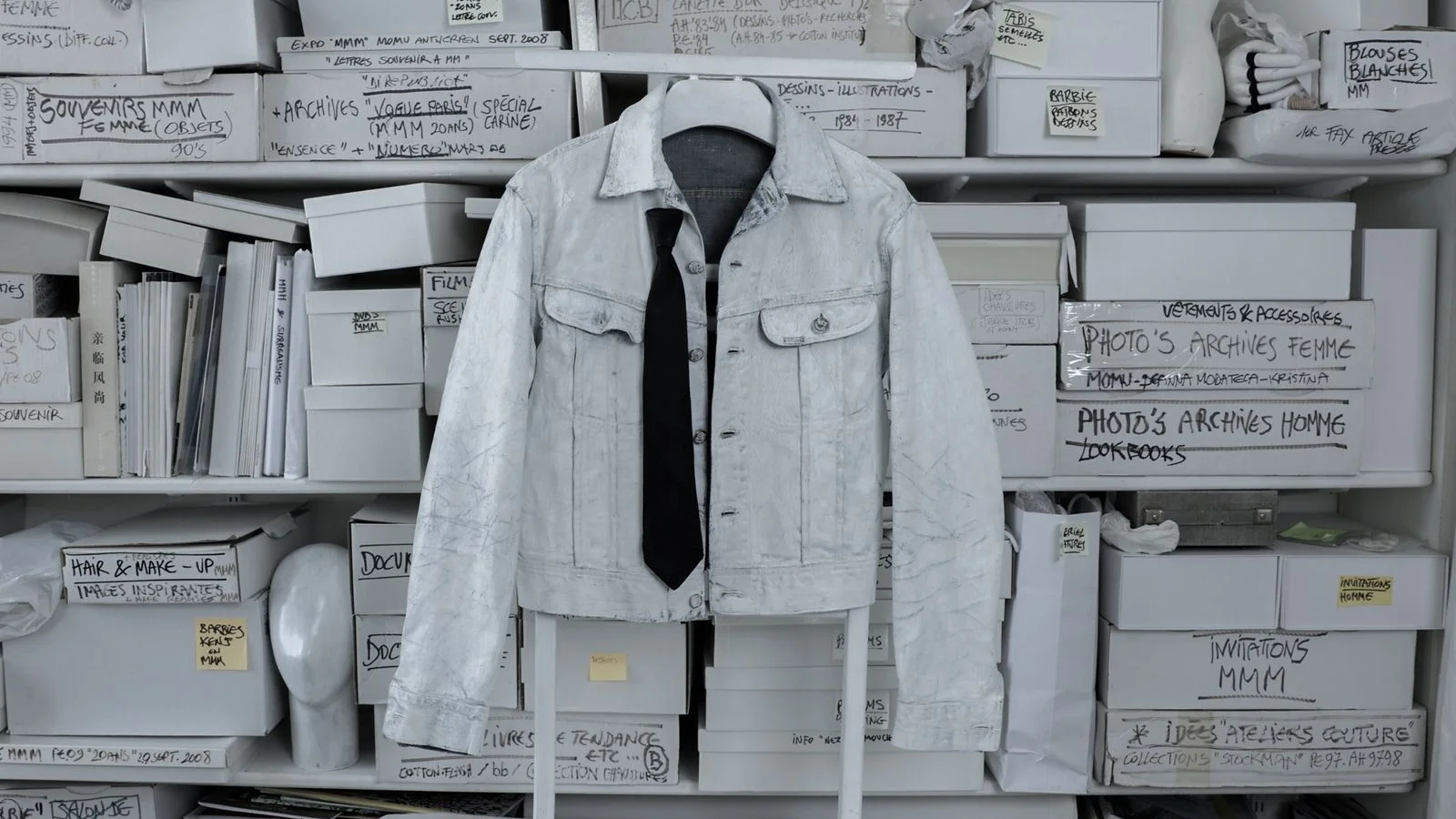 Image may contain Clothing Coat Jacket Accessories Formal Wear Tie Vest Pants Shirt Long Sleeve Sleeve and Person