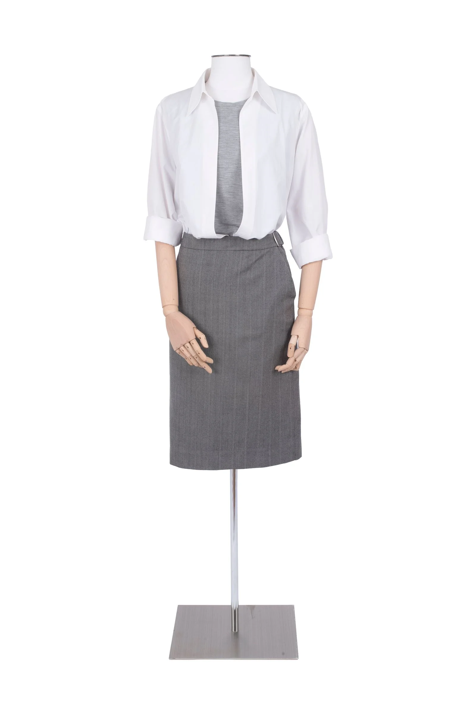 Image may contain Clothing Skirt Blouse Shirt Formal Wear and Coat