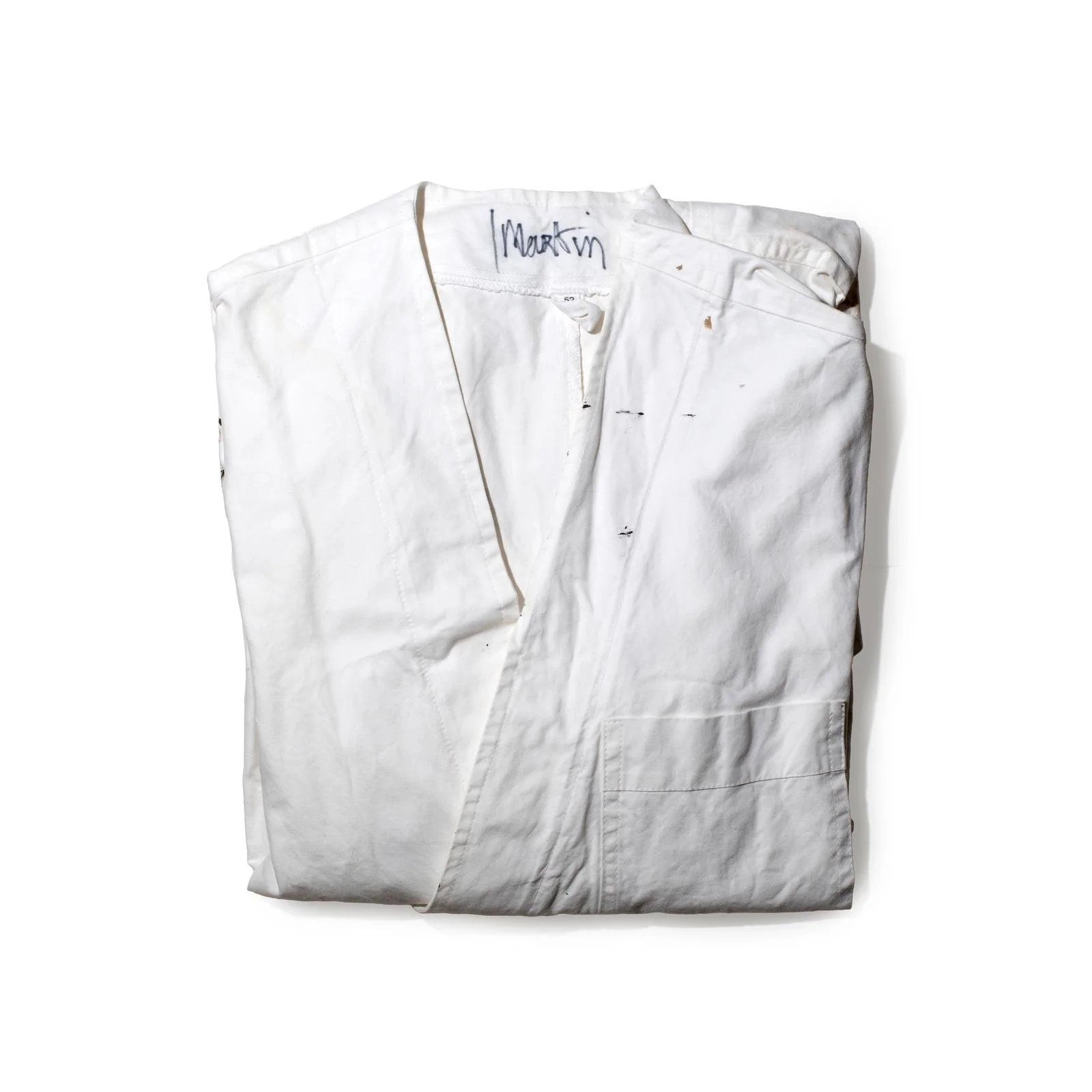 Image may contain Clothing Vest Coat Home Decor Linen Lab Coat Jacket and Shirt