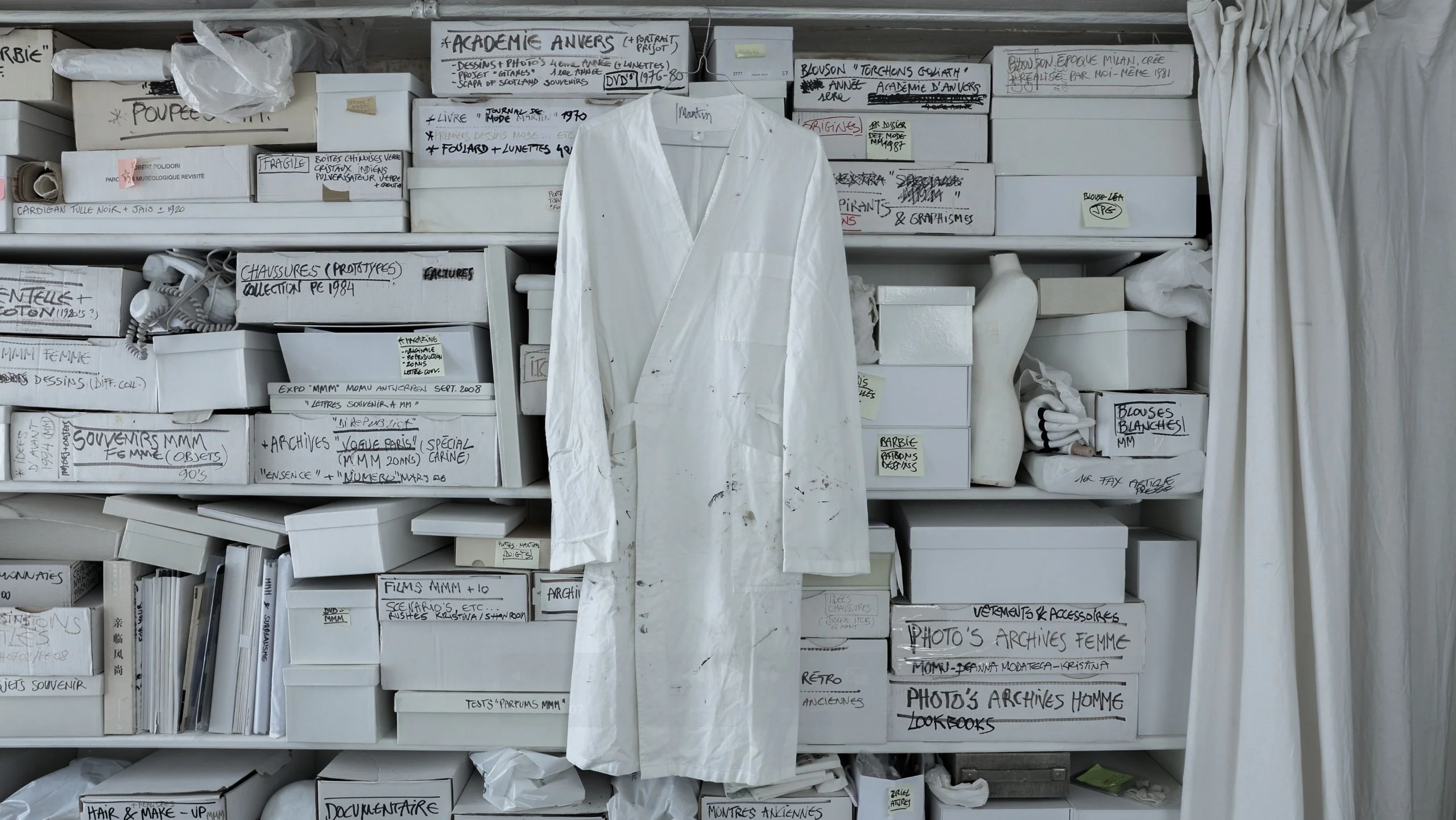 Image may contain Clothing Coat Lab Coat and Box