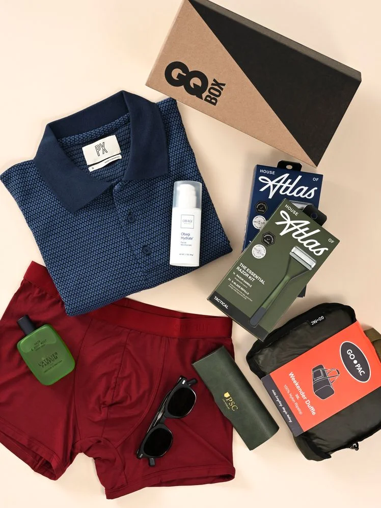 Image may contain Clothing Shorts Shirt Vest Credit Card Text Bottle Cosmetics and Perfume