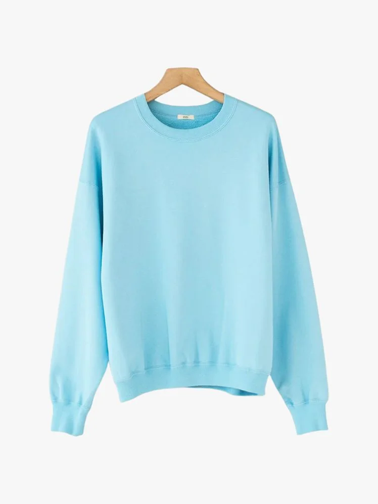 Image may contain Clothing Knitwear Sweater Sweatshirt Long Sleeve Sleeve Blouse and Hoodie