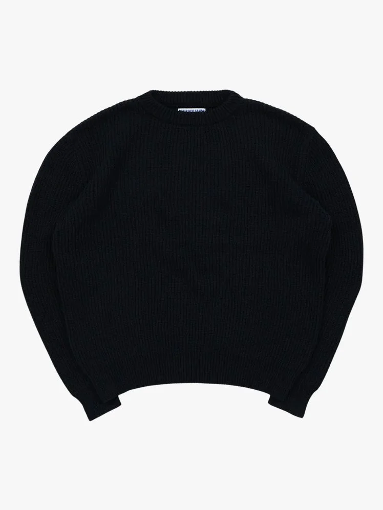 Image may contain Cap Clothing Hat Knitwear Sweater and Swimwear
