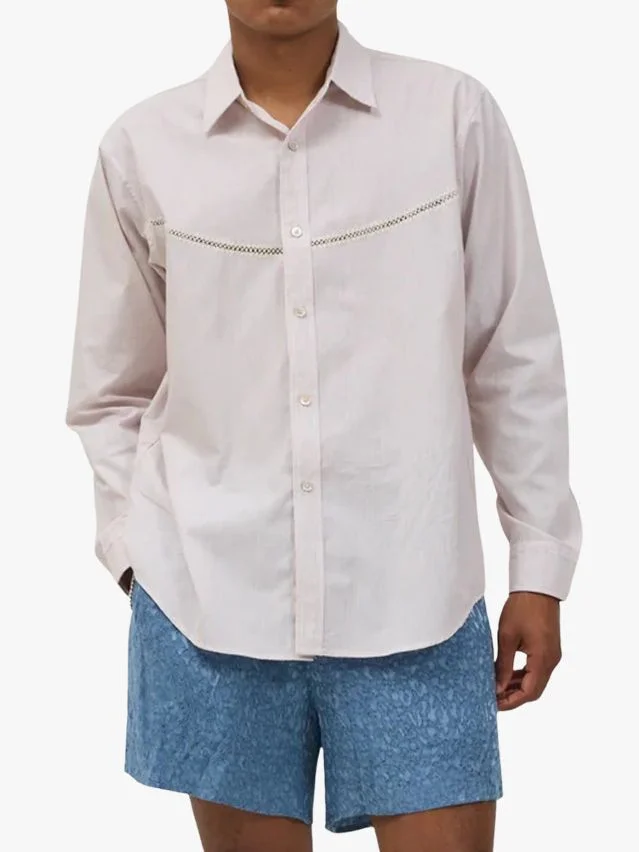 Image may contain Clothing Shirt Dress Shirt Sleeve Shorts Blouse Beachwear and Long Sleeve