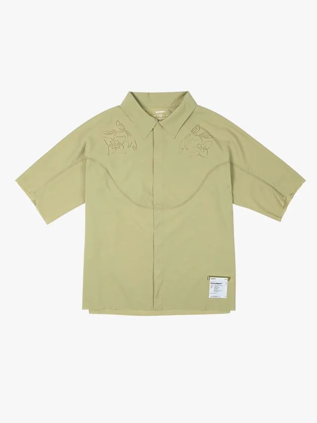Image may contain Clothing Shirt Khaki Blouse Sleeve Long Sleeve and Coat