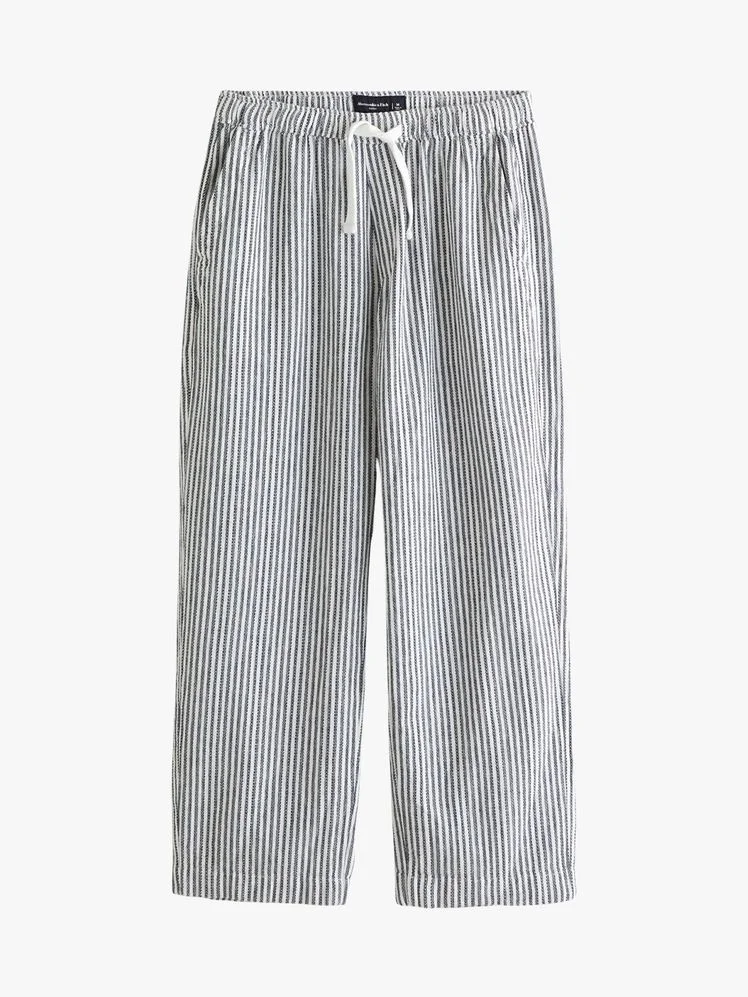 Image may contain Clothing Shorts Swimming Trunks Jeans and Pants