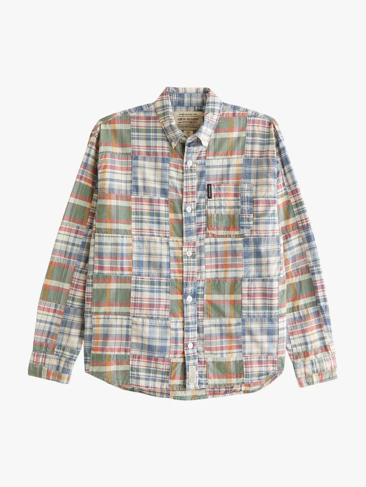Image may contain Clothing Shirt Dress Shirt Blouse Long Sleeve and Sleeve