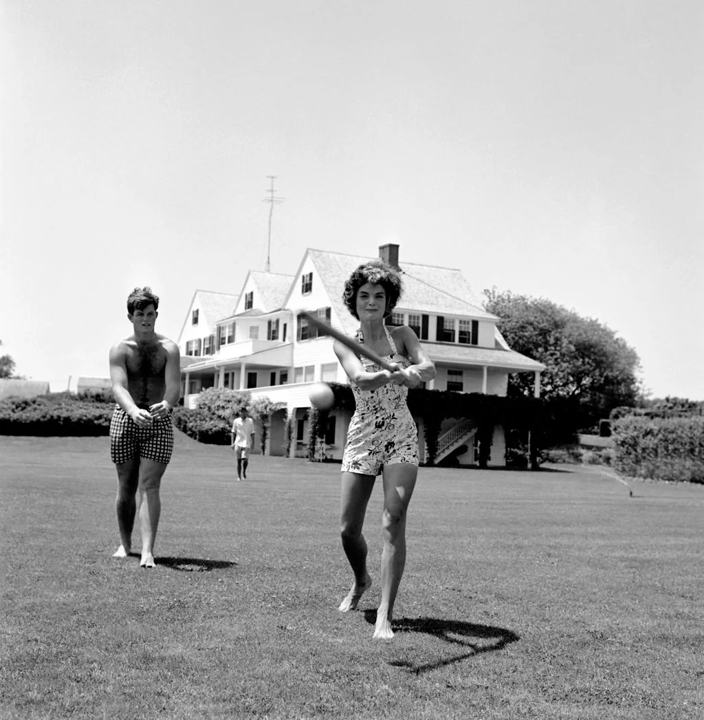 Image may contain Jacqueline Kennedy Onassis Ted Kennedy Clothing Shorts Grass Plant Neighborhood Face and Head