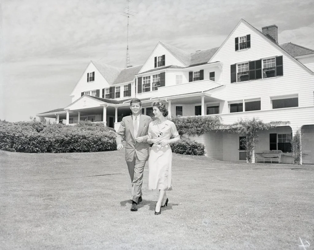 Image may contain John F. Kennedy Architecture Building Outdoors Shelter Neighborhood Grass Plant Face and Head