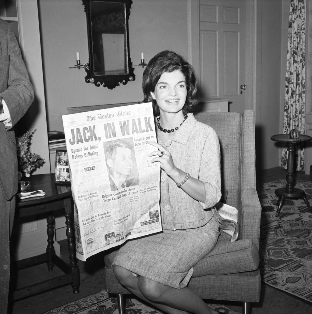 Image may contain Jacqueline Kennedy Onassis John F. Kennedy Adult Person Text Couch Furniture Face Head and Chair