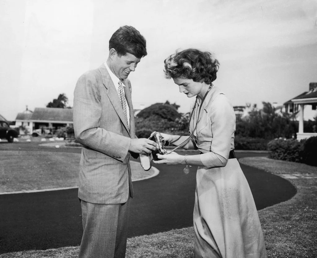 Image may contain John F. Kennedy Jacqueline Kennedy Onassis Clothing Coat Adult Person Formal Wear and Suit