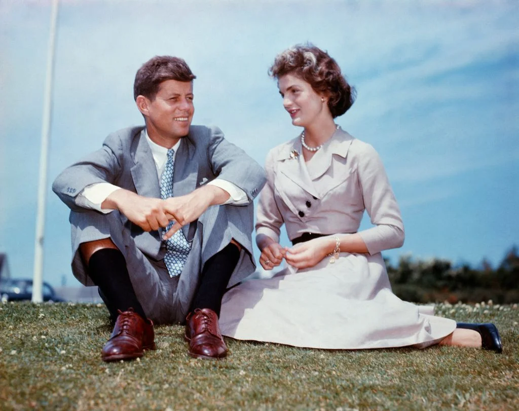 Image may contain John F. Kennedy Jacqueline Kennedy Onassis Blazer Clothing Coat Jacket Footwear Shoe and Grass