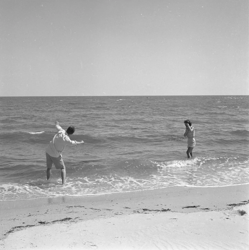 Image may contain Beach Coast Nature Outdoors Sea Shoreline Water Clothing Shorts Photography Person and Face