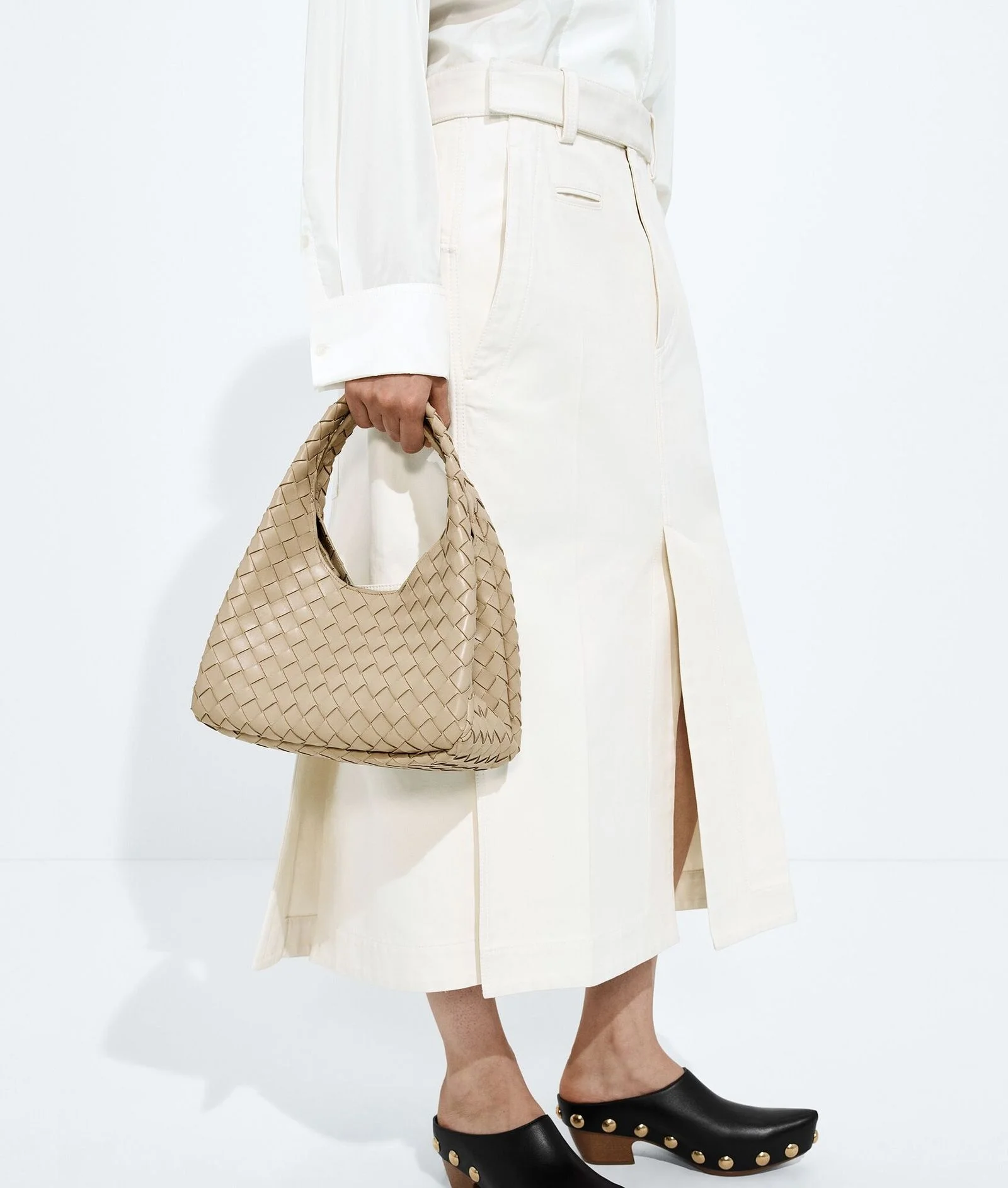 Image may contain Accessories Bag Handbag Clothing Footwear Shoe Skirt Adult and Person