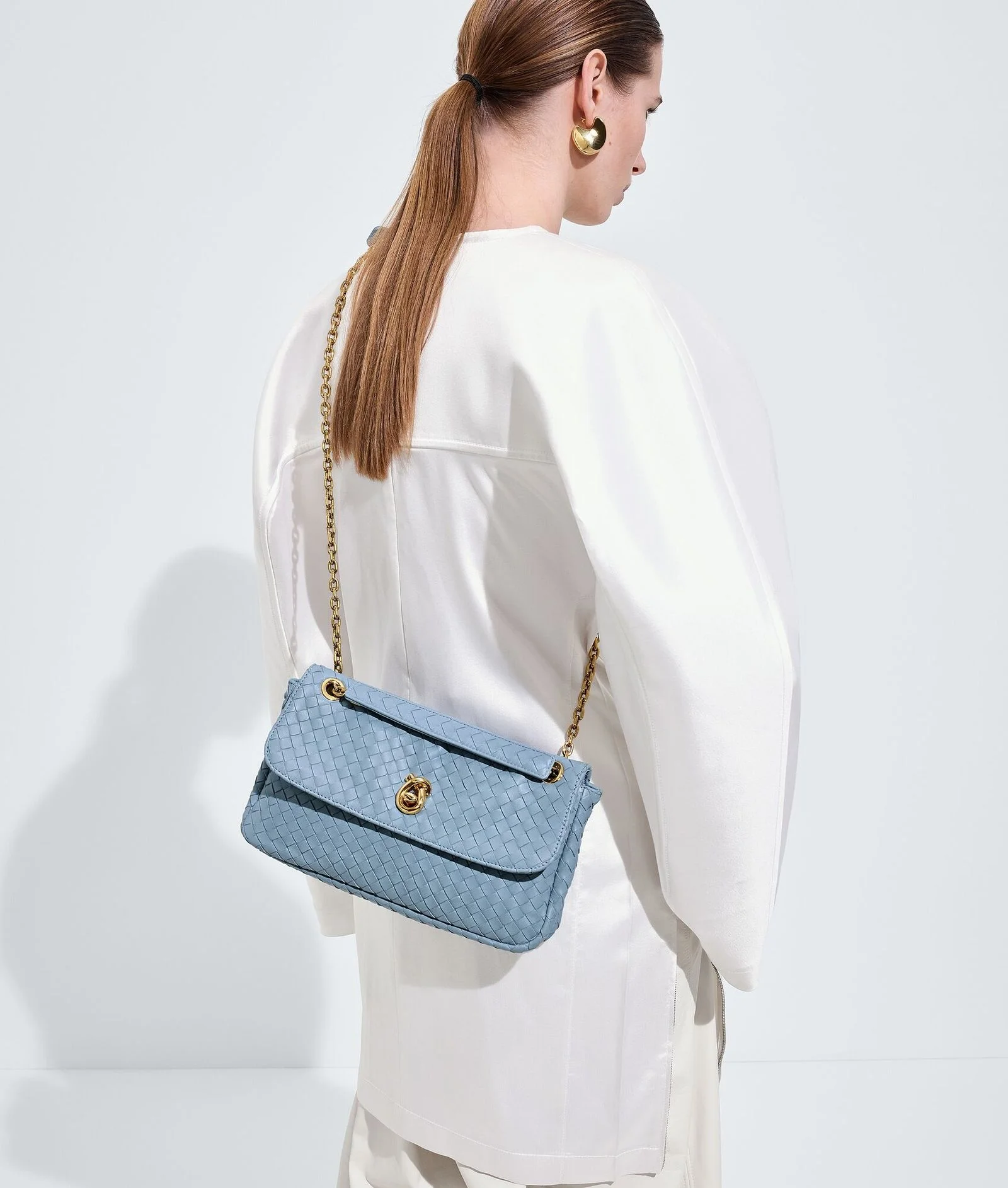 Image may contain Accessories Bag Handbag Purse Clothing and Coat