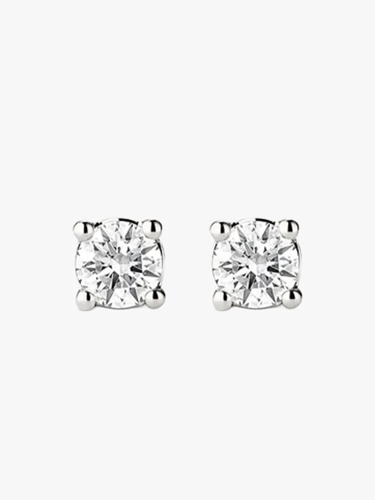Image may contain: Accessories, Earring, Jewelry, Diamond, Gemstone, and Silver