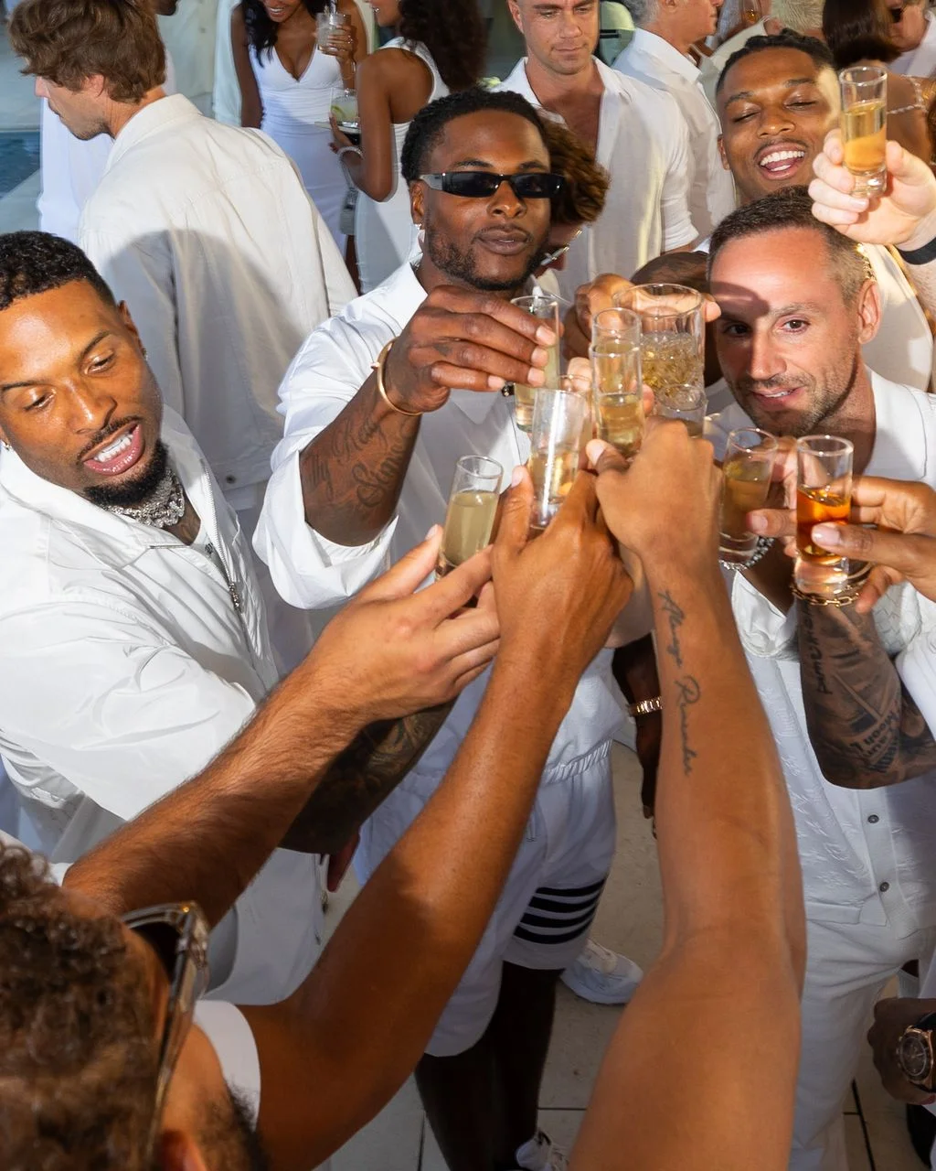 Image may contain Odell Beckham Jr. Davante Adams Fun Party Accessories Sunglasses Adult Person Alcohol and Beer
