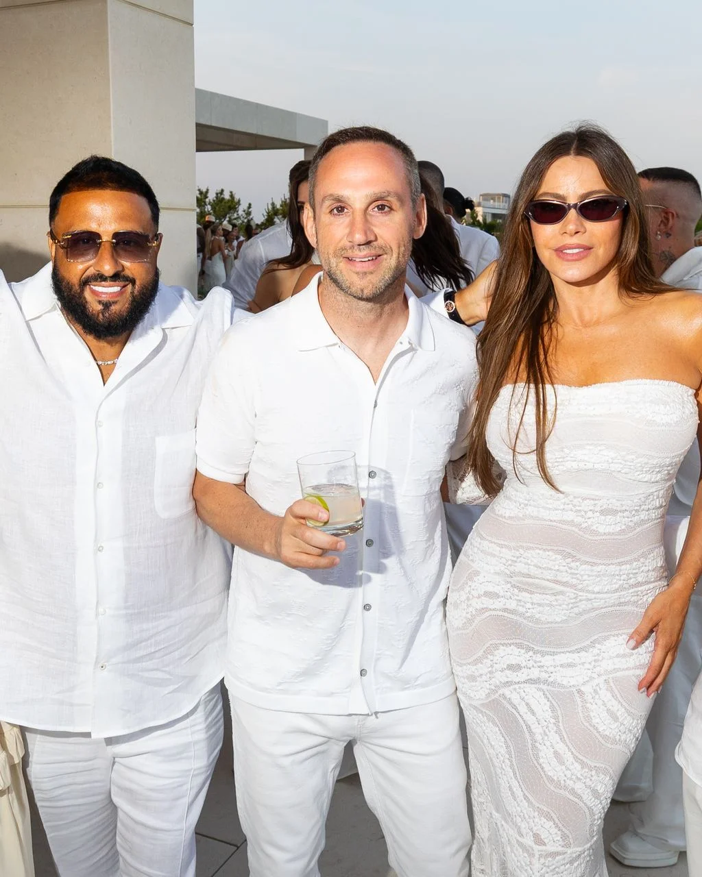 Image may contain DJ Khaled Sofía Vergara Person Photobombing Fashion Adult Wedding Accessories Glasses and People