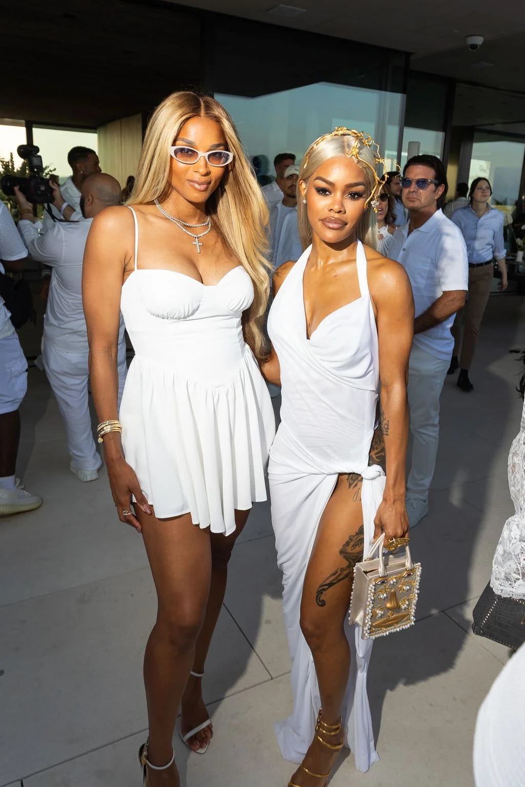 Image may contain Teyana Taylor Ciara Adult Person Fashion Clothing Dress Wedding Photobombing and Accessories