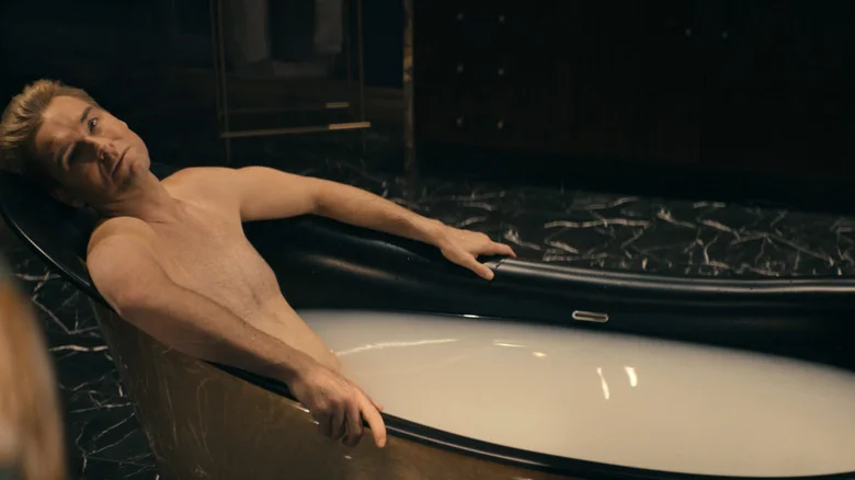 Homelander (Antony Starr) lies in a tub full of milk in The Boys