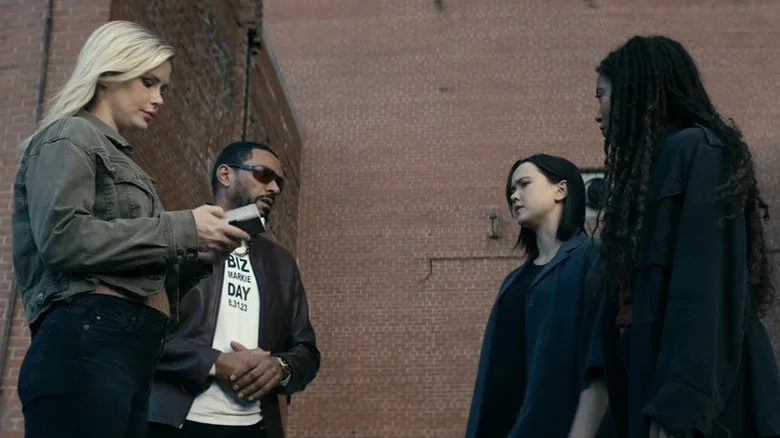 Annie January (Erin Moriarty) examines a device while Mother's Milk (Laz Alonso) speaks to Jordan Li (London Thor) and Marie Moreau (Jaz Sinclair) in The Boys