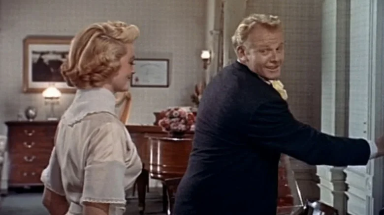 Alan Hale Jr's Robert Neary closes a door as Dorothy Malone's Fran Tuttle watches in Young at Heart