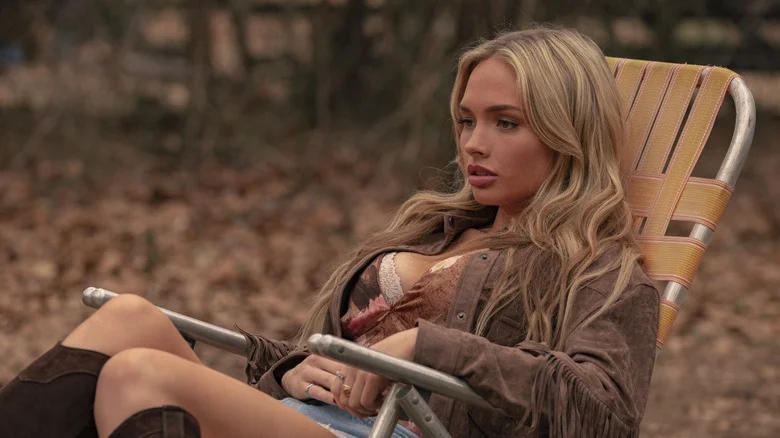 Natalie Alyn Lind's Oreana Jackson sits in a recliner outside in Dutton Ranch