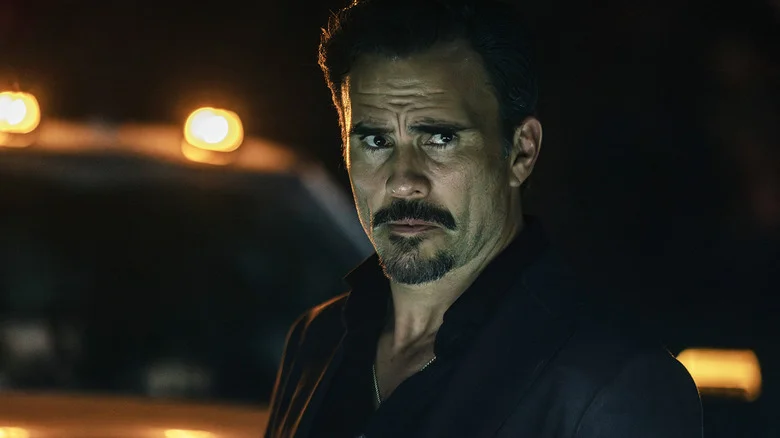 Juan Pablo Raba's Joaquin Reyes stands in front of a truck at night in Dutton Ranch
