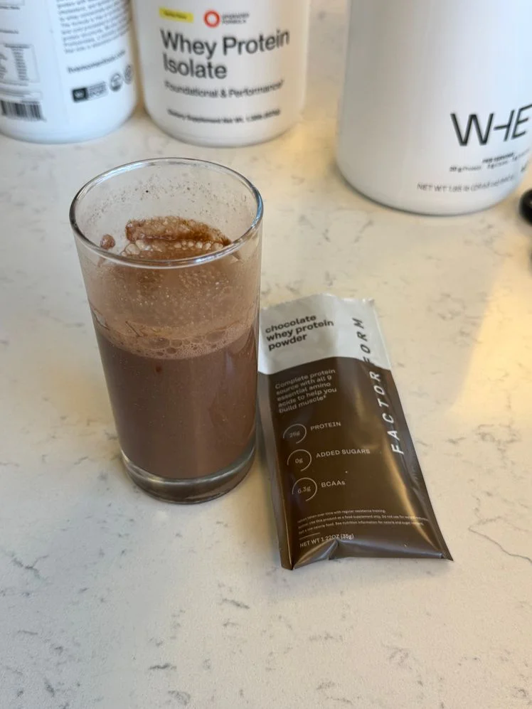 Factor Form chocolate whey protein mixed into a shake